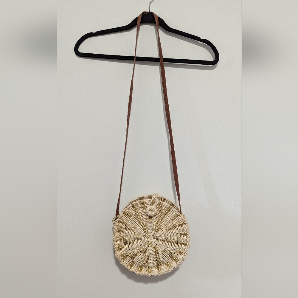 American Eagle straw bag with gold accent thread.
